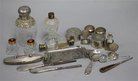 A quantity of silver mounted dressing table items, including a rock crystal glass scent bottle,